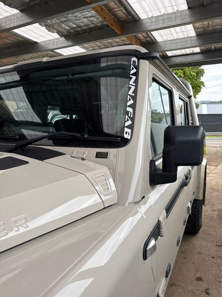 CannaFab snorkel sticker shown on the cab window of a white ute