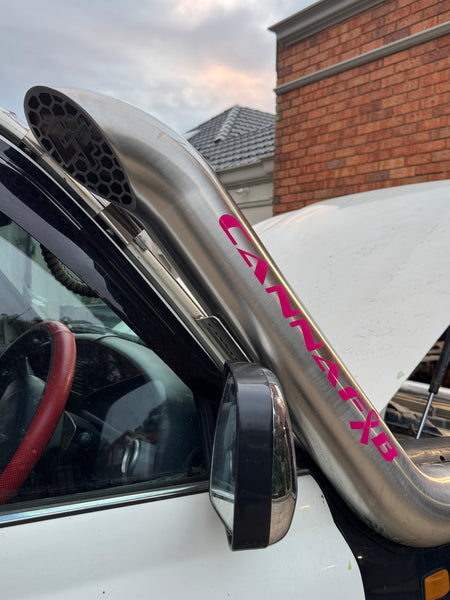 Pink CannaFab windshield sticker on a brushed stainless snorkel