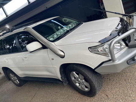 Canna Fabrication twin snorkels fitted to a white Toyota LandCruiser 200 Series - guard close-up