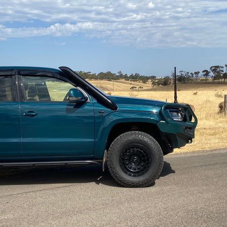 Green Volkswagen Amarok rear three-quarter view with Canna Fabrication stainless snorkel