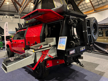 titan terrain mounted on back of heavily modified ute canopy at a trade show