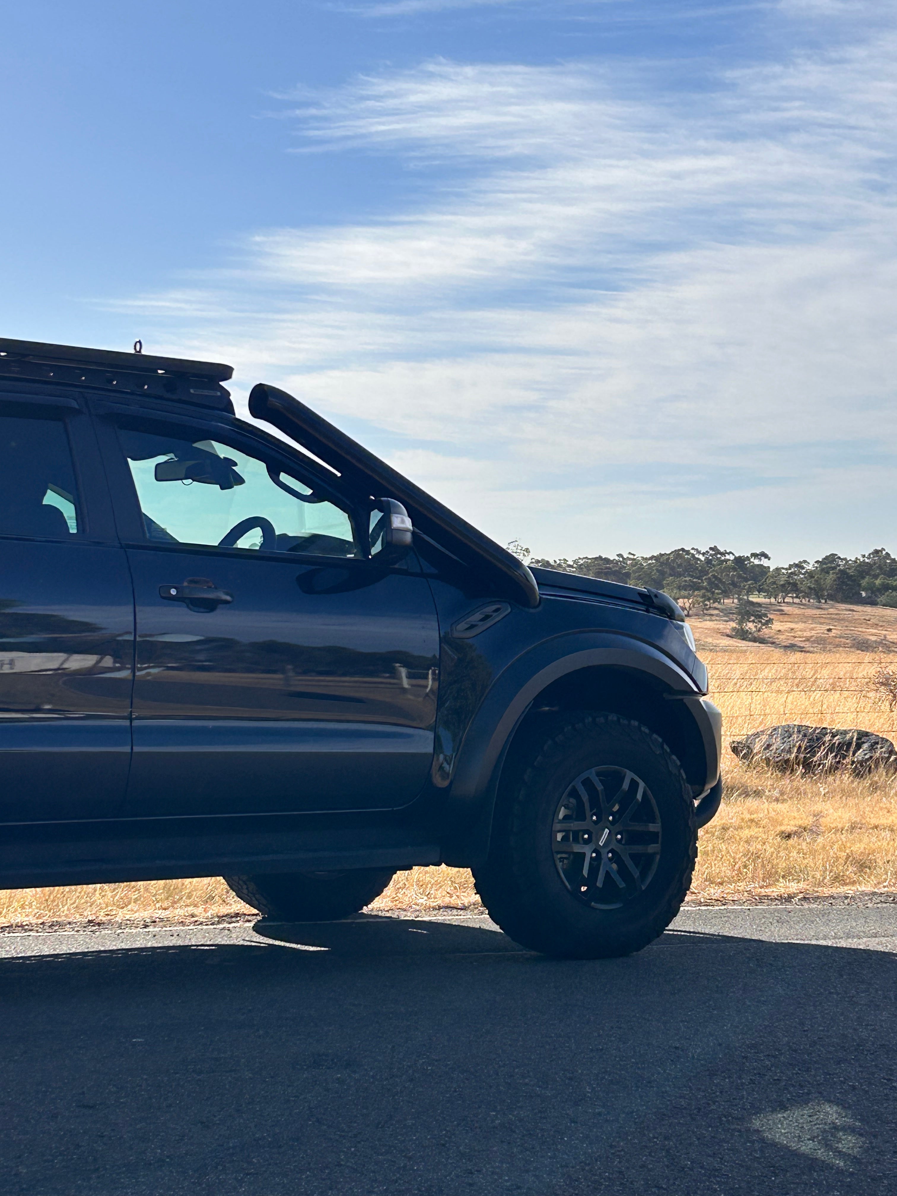 Side view of a Ford Ranger Raptor PX3 fitted with a Canna Fabrication short-entry snorkel