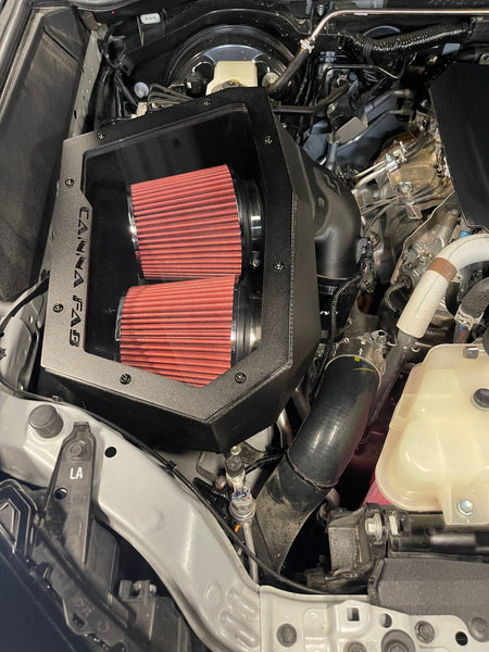 Canna Fabrication Hilux N90 twin pod filter airbox with red filters — engine bay detail