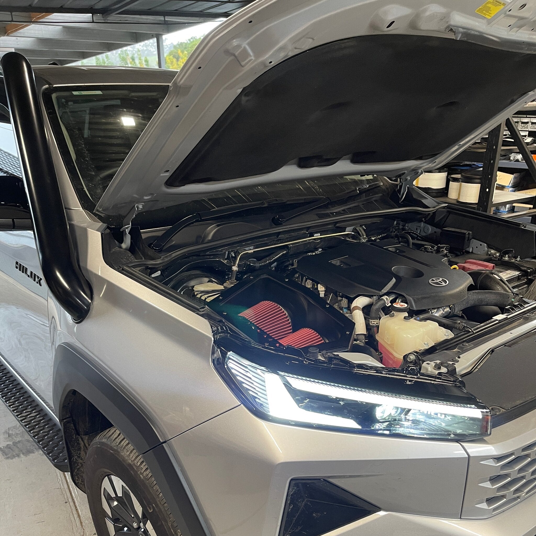 Toyota Hilux N90 with bonnet open during Canna Fabrication snorkel and airbox install
