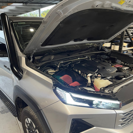 Toyota Hilux N90 with bonnet open during Canna Fabrication snorkel and airbox install