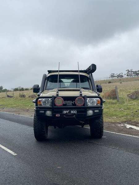 Toyota LandCruiser 79 Series on the road with Canna Fabrication 5 inch twin snorkels — front view