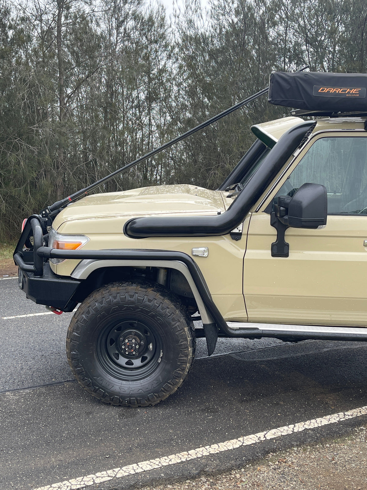 Sand Toyota LandCruiser 79 with rooftop tent and Canna Fabrication 5 inch twin snorkels — side view