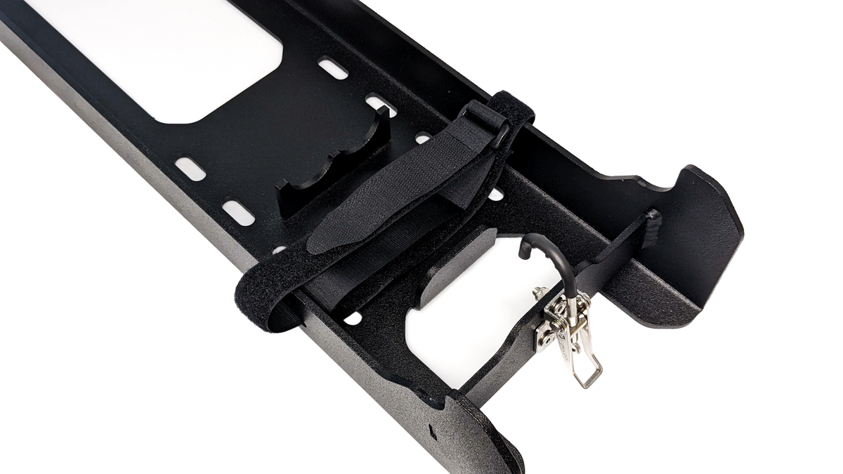 Close up of lock and strap mechanism on mounting bracket for Titan terrain jack 