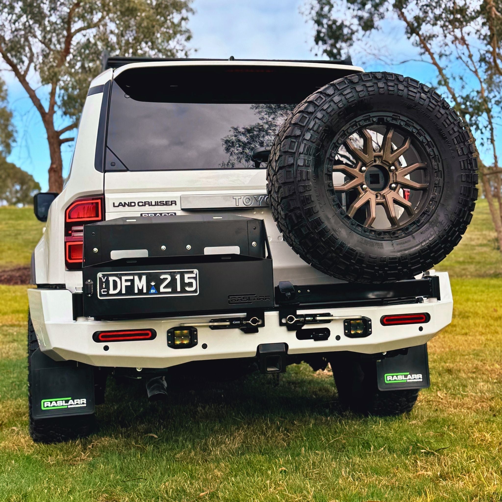 This is an image of the 250 Series Prado Toyota Landcruiser Rear Bar and Wheel Carrier setup by Raslarr Engineering Made in Australia White Black HERO photo straight on