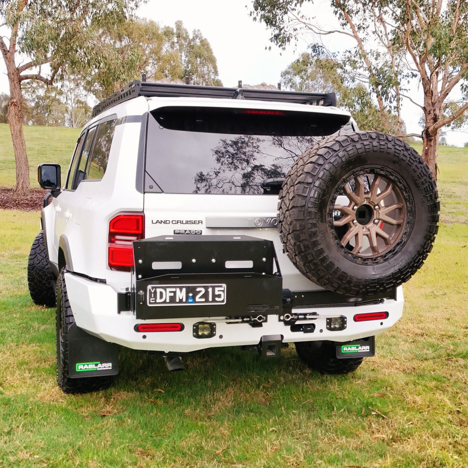 This is an image of the 250 Series Prado Toyota Landcruiser Rear Bar and Wheel Carrier setup by Raslarr Engineering Made in Australia White