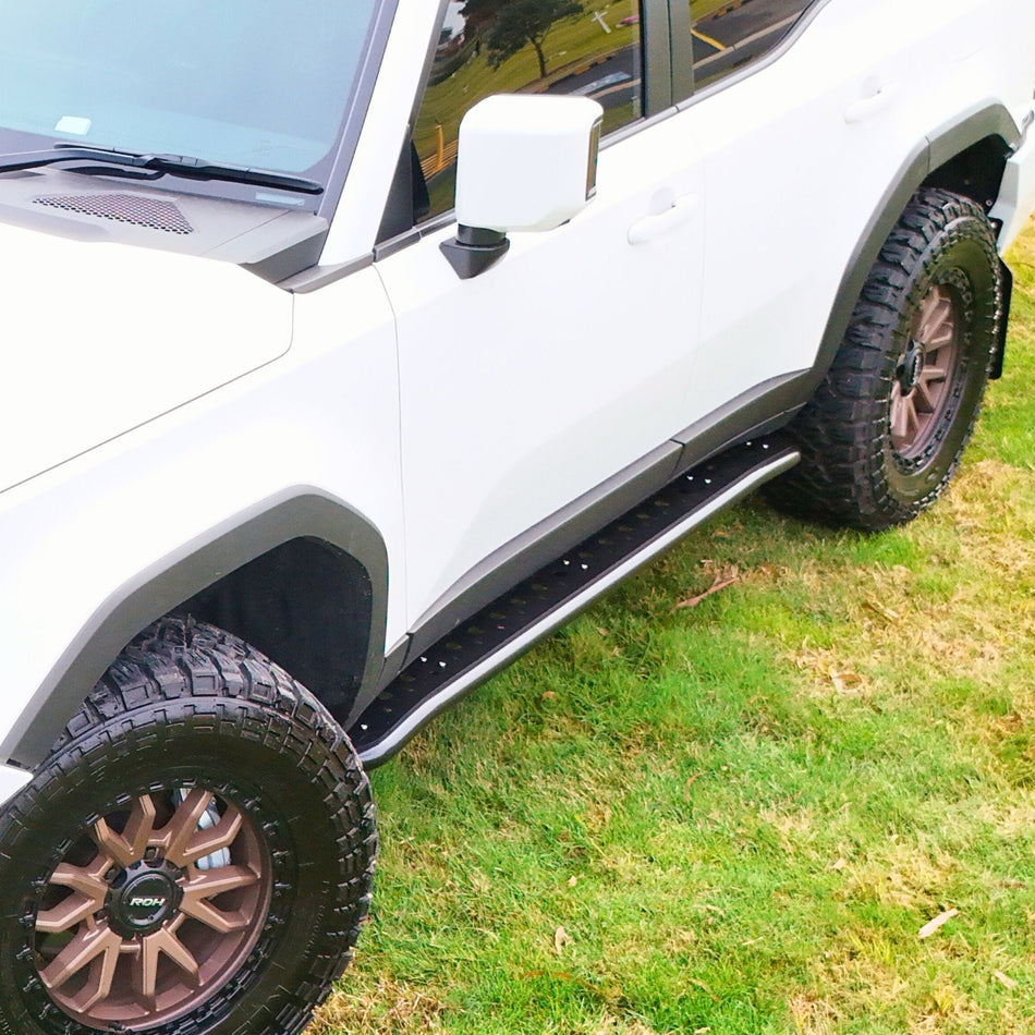This is an image of the 250 Series Prado Toyota Landcruiser Rock Sliders and side steps by Raslarr Engineering. Made in Australia White Black
