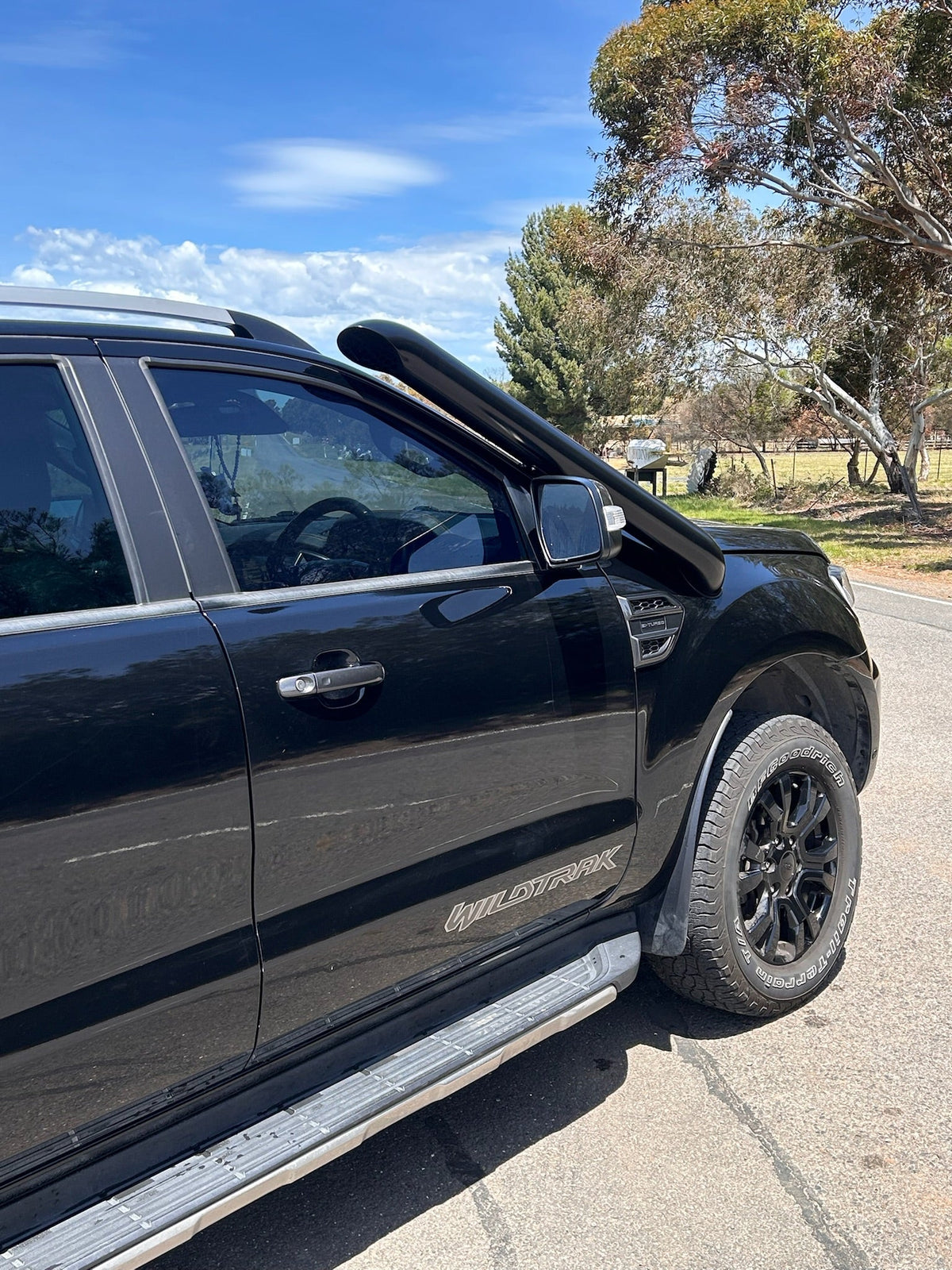 Ford Ranger PX short-entry snorkel by Canna Fabrication installed on vehicle, featuring durable design and functional air intake extension.