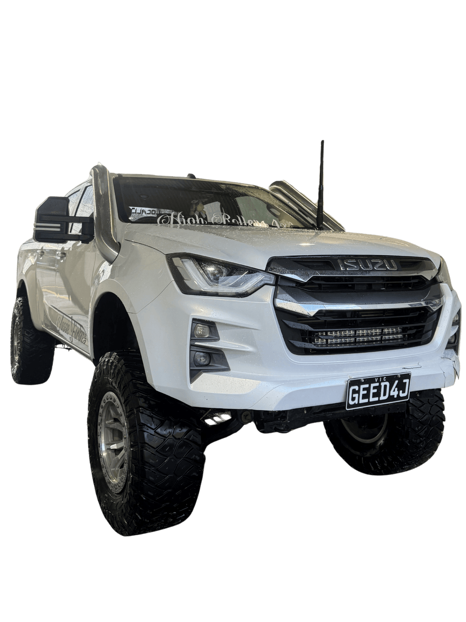 White Isuzu D-Max with sports bar and Canna Fabrication brushed-silver short-entry snorkel — front three-quarter studio view