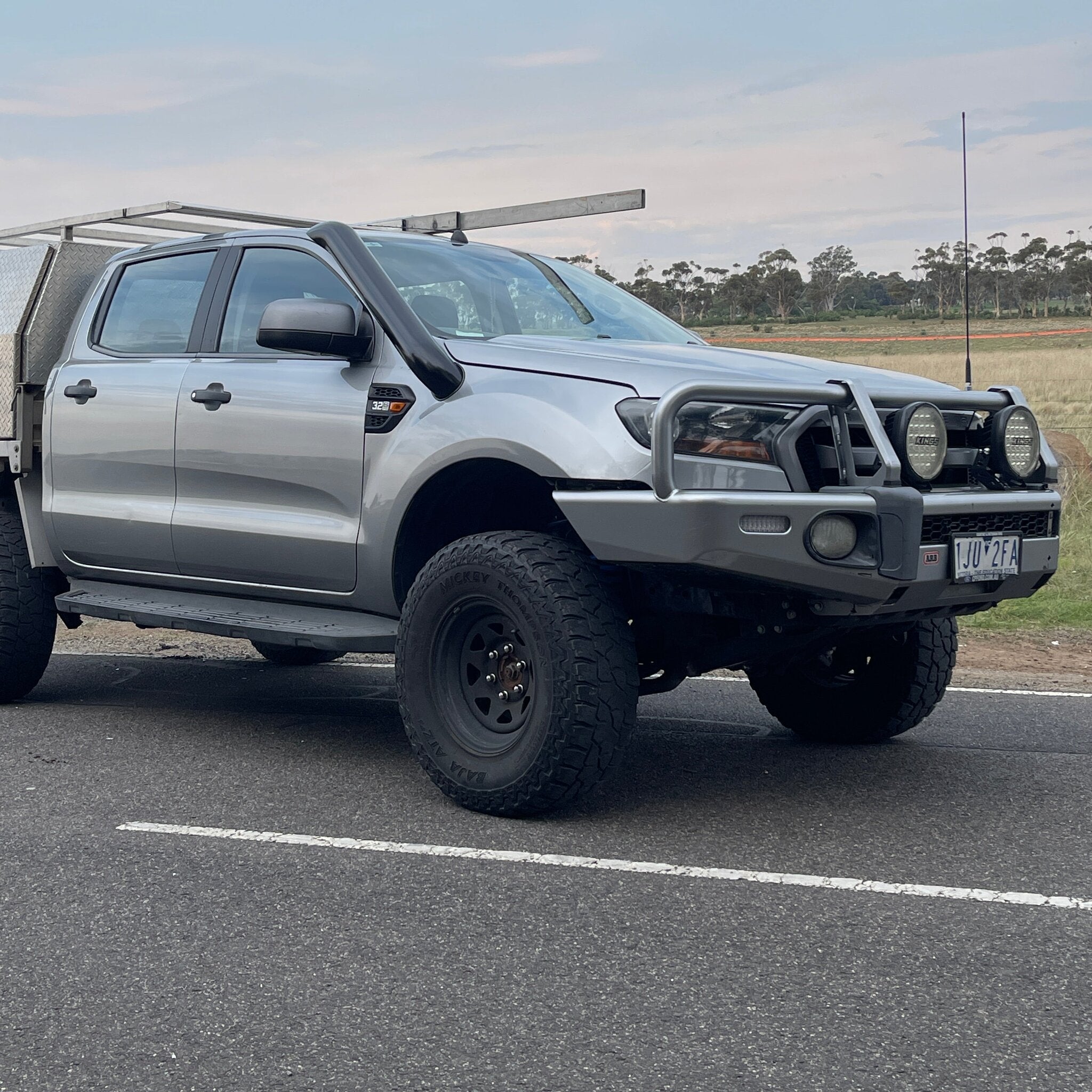 Silver Ford Ranger PX with bullbar and Canna Fabrication short-entry stainless snorkel — front three-quarter view
