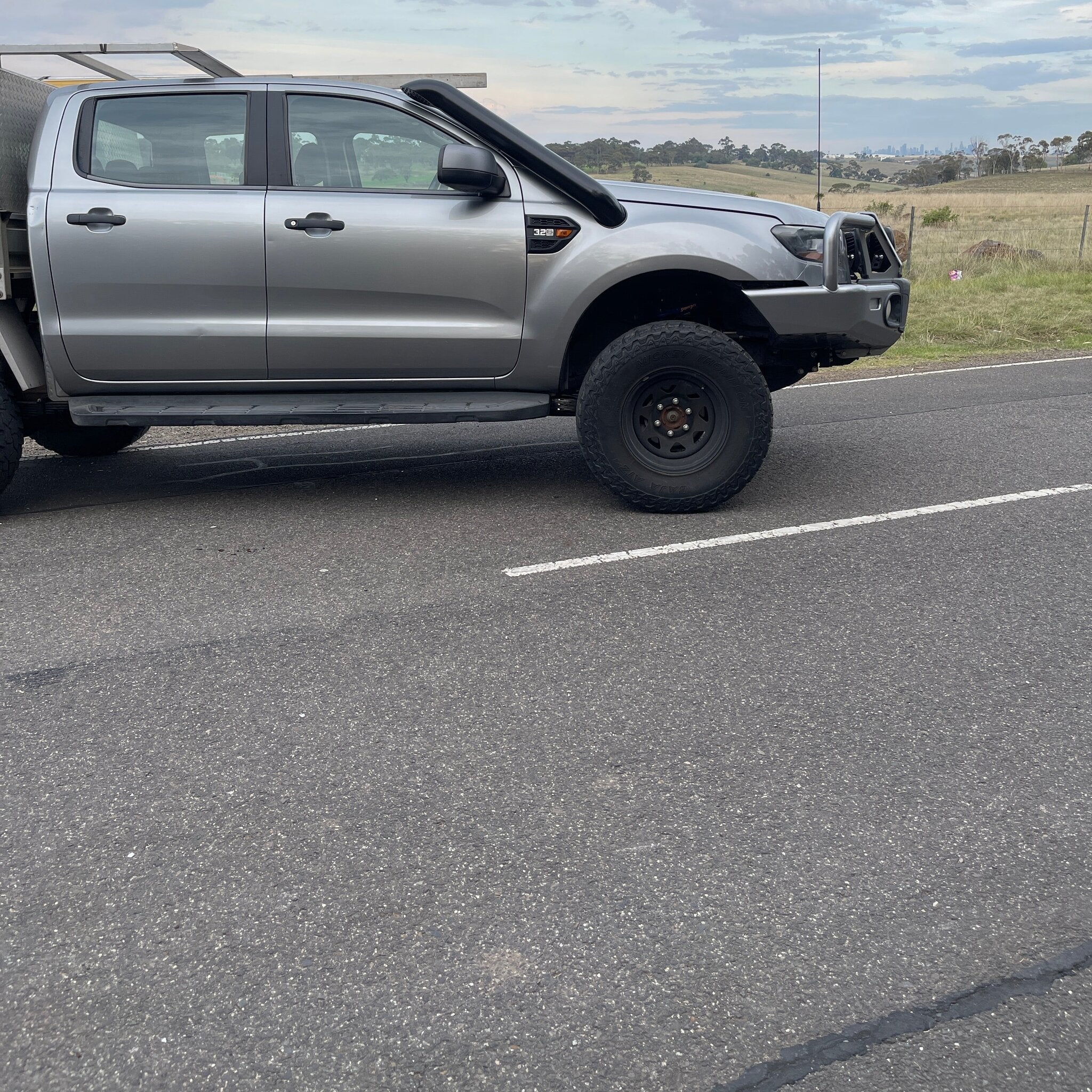 Silver Ford Ranger PX side profile showing the Canna Fabrication short-entry stainless snorkel